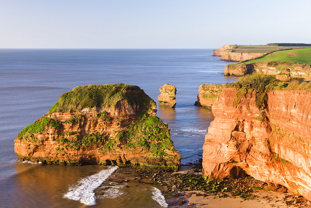 Red sandstone cliffs of Ladram Bay on the Jurassic Coast, UNESCO World Heritage Site, Devon, England, United Kingdom, Europe