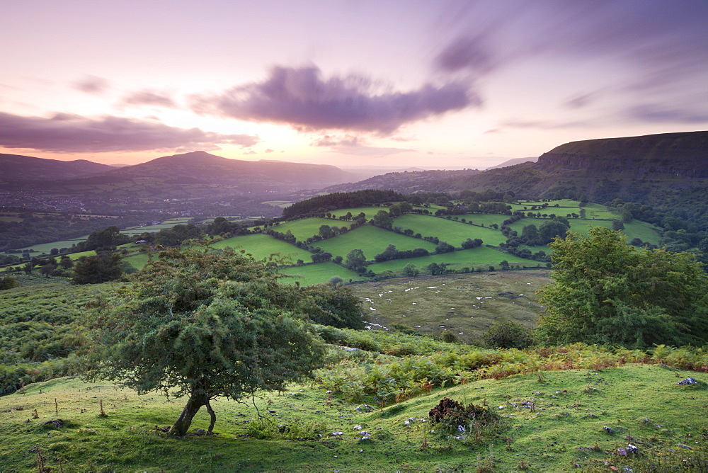 Sunrise over the Sugar Loaf viewed from Craig y Cilau near the Llangattock Escarpment, Brecon Beacons National Park, Powys, Wales, United Kingdom, Europe