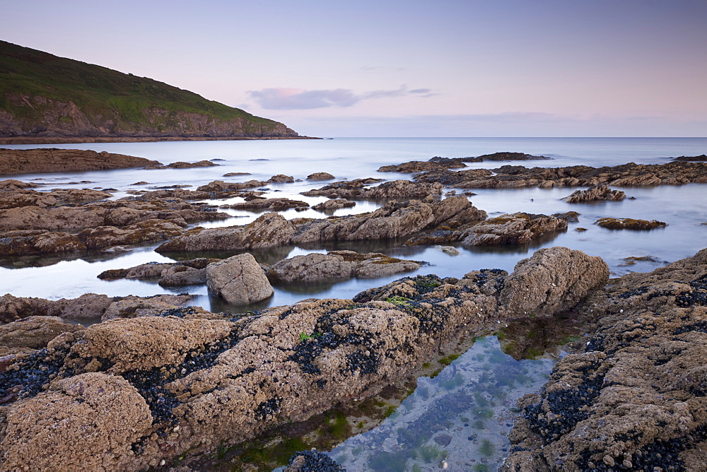 Twilight over Hemmick Beach, looking towards Gell Point, Boswinger, Cornwall, England, United Kingdom, Europe