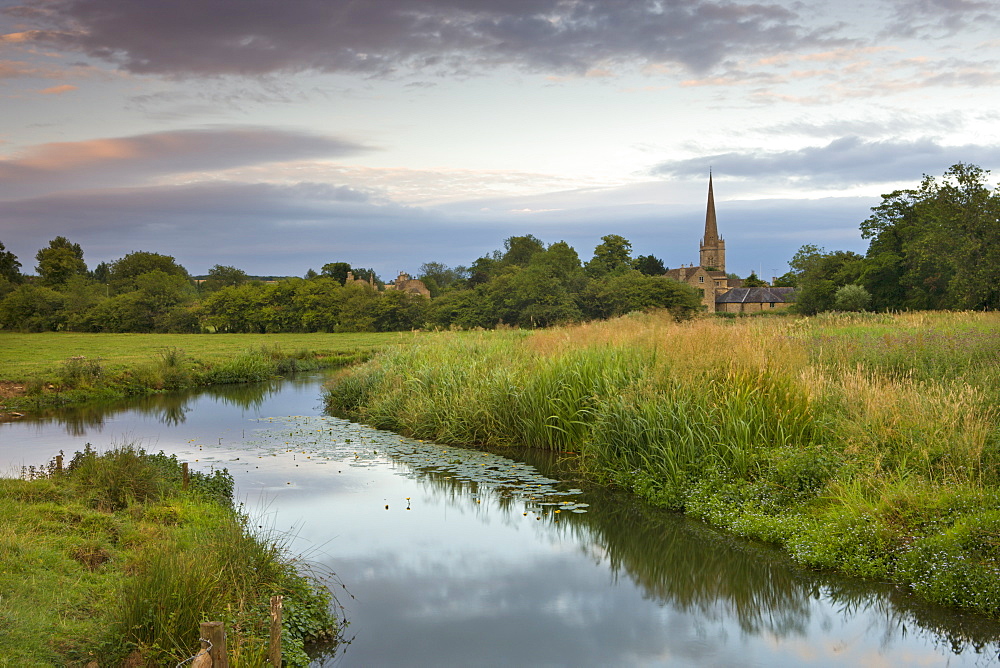 Burford Church and the River Windrush watermeadows at Burford, The Cotswolds, Oxfordshire, England, United Kingdom, Europe