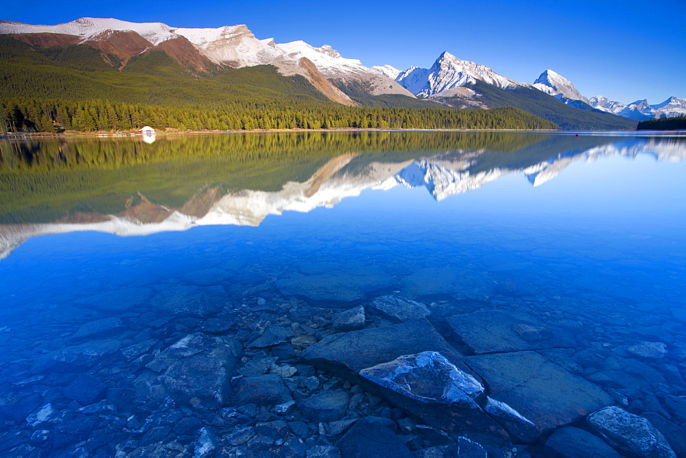 Crystal clear water with reflections at Maligne Lake, Canadian Rockies, Jasper National Park, UNESCO World Heritage Site, Alberta, Canada, North America