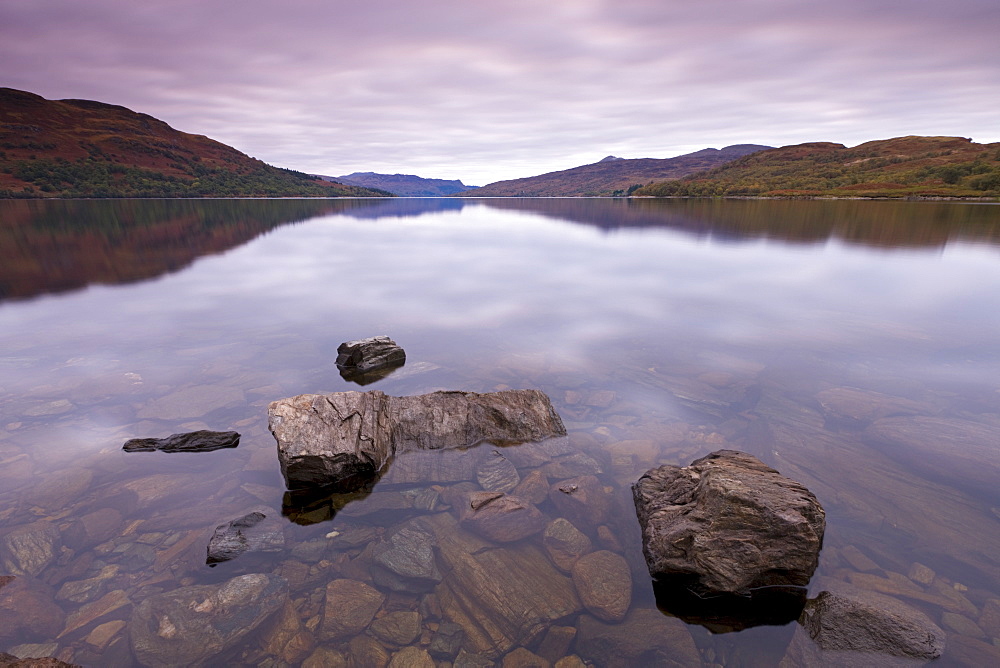 Still waters on Loch Katrine in the Trossachs in autumn, Stirling, Scotland, United Kingdom, Europe