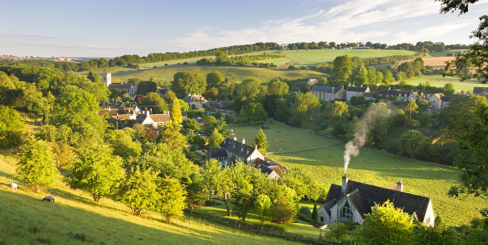 Cottages nestled into the valley in the picturesque Cotswolds village of Naunton, Gloucestershire, England, United Kingdom, Europe