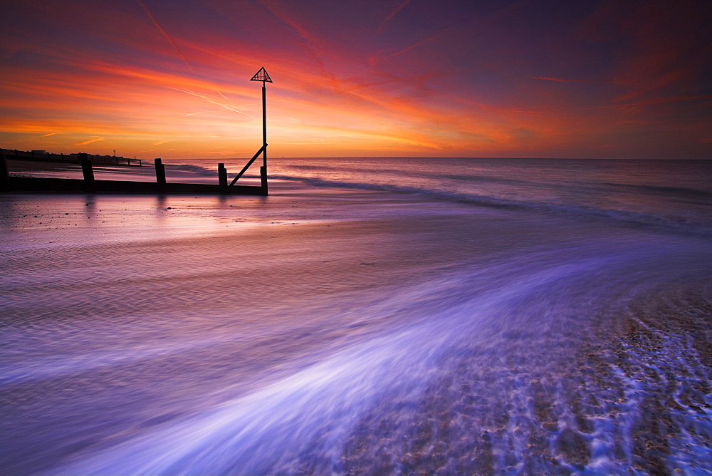 Surging tide at dawn on a Hayling Island beach, Hampshire, England, United Kingdom, Europe