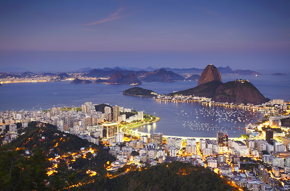 View of Sugar Loaf Mountain (Pao de Acucar) and Botafogo Bay at dusk, Rio de Janeiro, Brazil, South America 