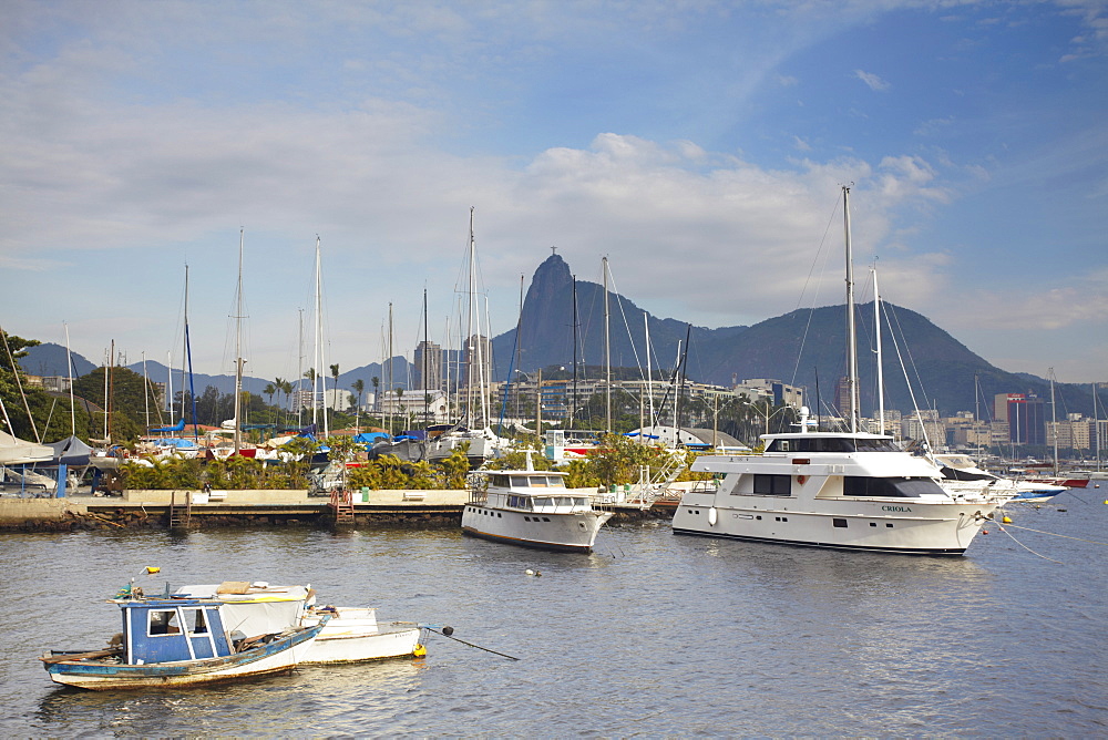 Boats in Guanabara Bay with Christ the Redeemer statue (Cristo Redentor) in the background, Urca, Rio de Janeiro, Brazil, South America 