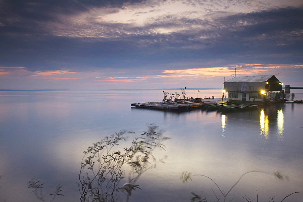 Boat landing moored on Rio Negro at sunset, Manaus, Amazonas, Brazil, South America 