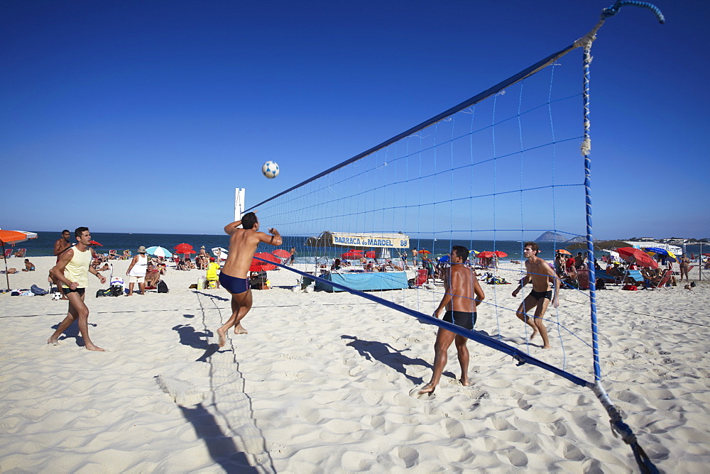 Men playing foot volley (futevolei) on Copacabana beach, Rio de Janeiro, Brazil, South America 