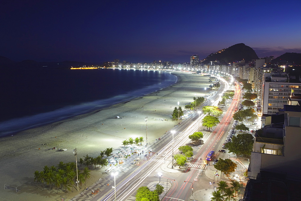 View of Copacabana beach and Avenida Atlantica at dusk, Copacabana, Rio de Janeiro, Brazil, South America 