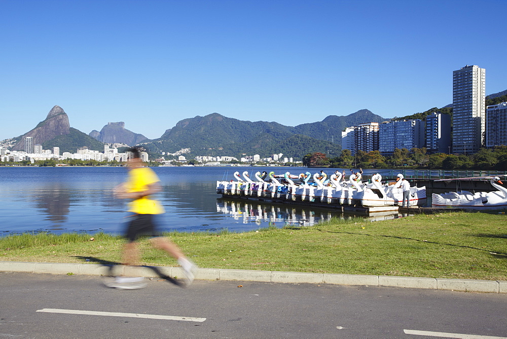 Person jogging on track around Lagoa Rodrigo de Freitas, Rio de Janeiro, Brazil, South America 