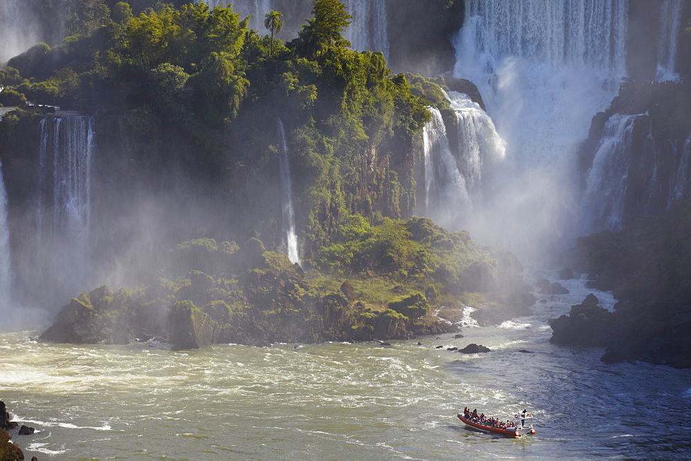 Tourist boat approaching Argentinean side of Iguacu Falls, Iguacu National Park, UNESCO World Heritage Site, Parana, Brazil, South America 