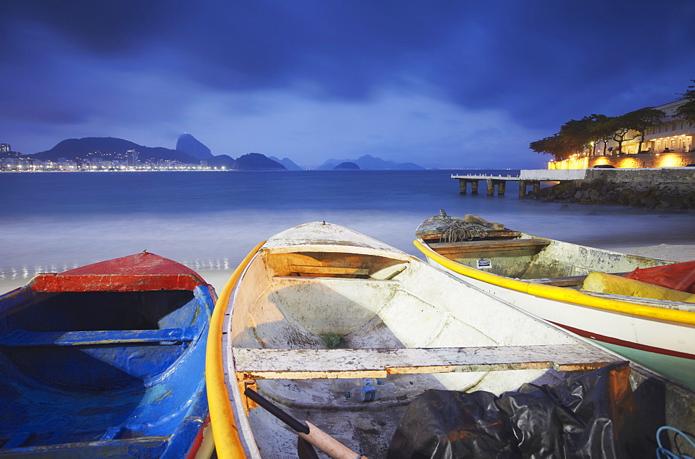 Fishing boats on Copacabana beach at dusk, Rio de Janeiro, Brazil, South America 