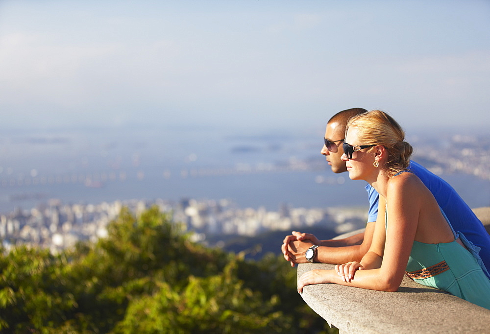 Couple enjoying view of Rio from Corcovado, Rio de Janeiro, Brazil, South America 