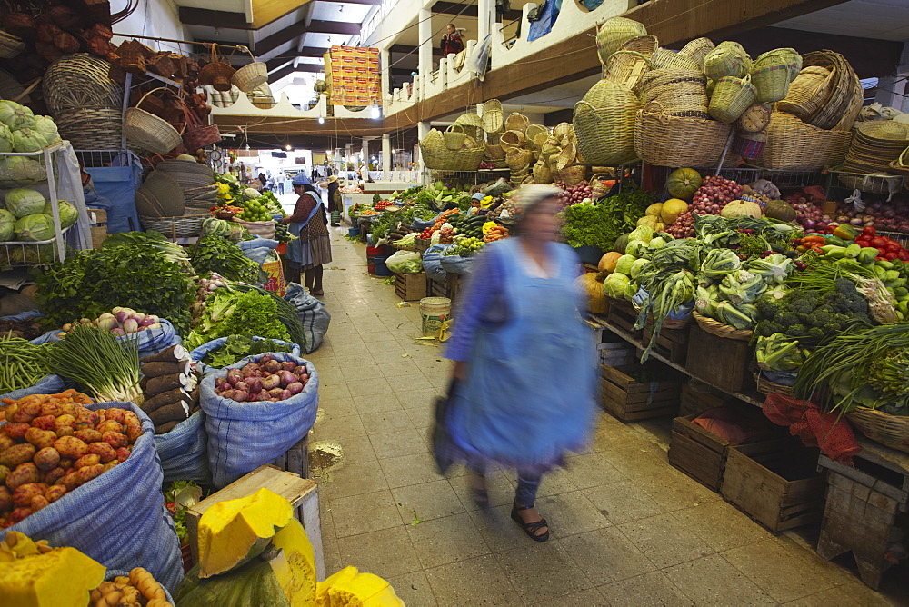 Woman walking through market, Sucre, UNESCO World Heritage Site, Bolivia, South America