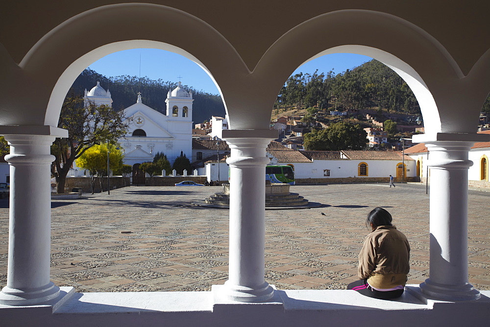 Woman sitting in Plaza Anzures, Sucre, UNESCO World Heritage Site, Bolivia, South America