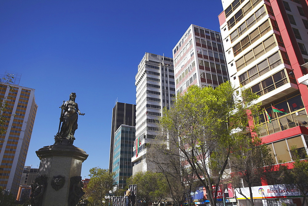 Statue and skyscrapers on Avenida 16 de Julio (El Prado), La Paz, Bolivia, South America