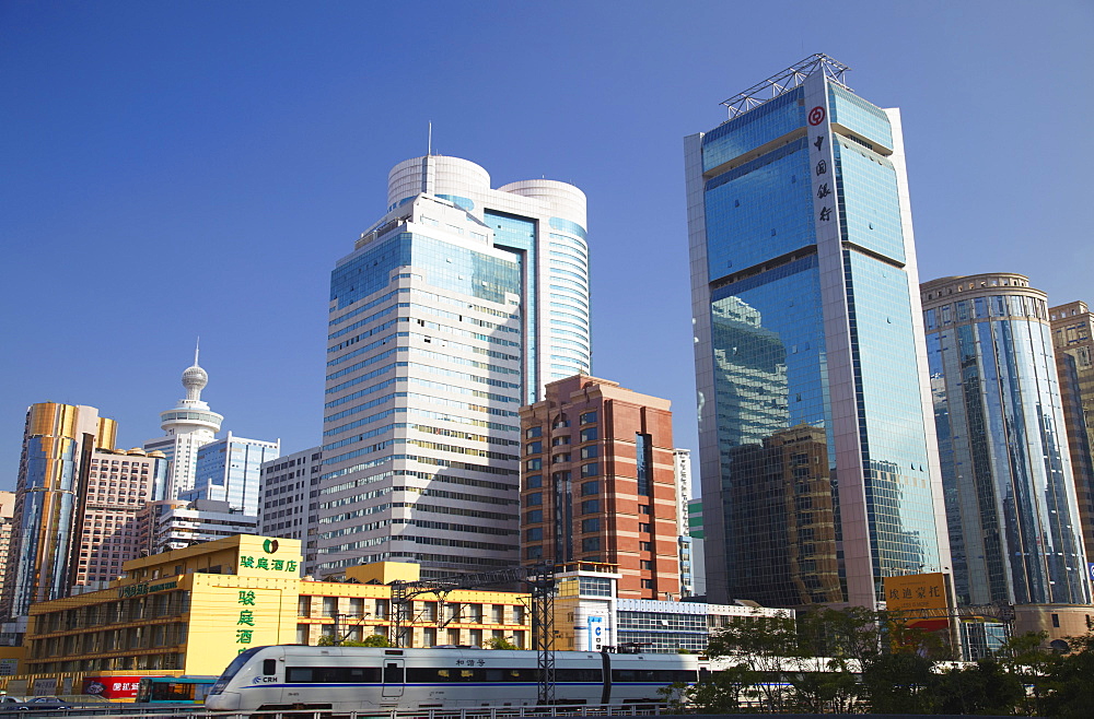 High speed train passing skyscrapers, Shenzhen, Guangdong, China, Asia