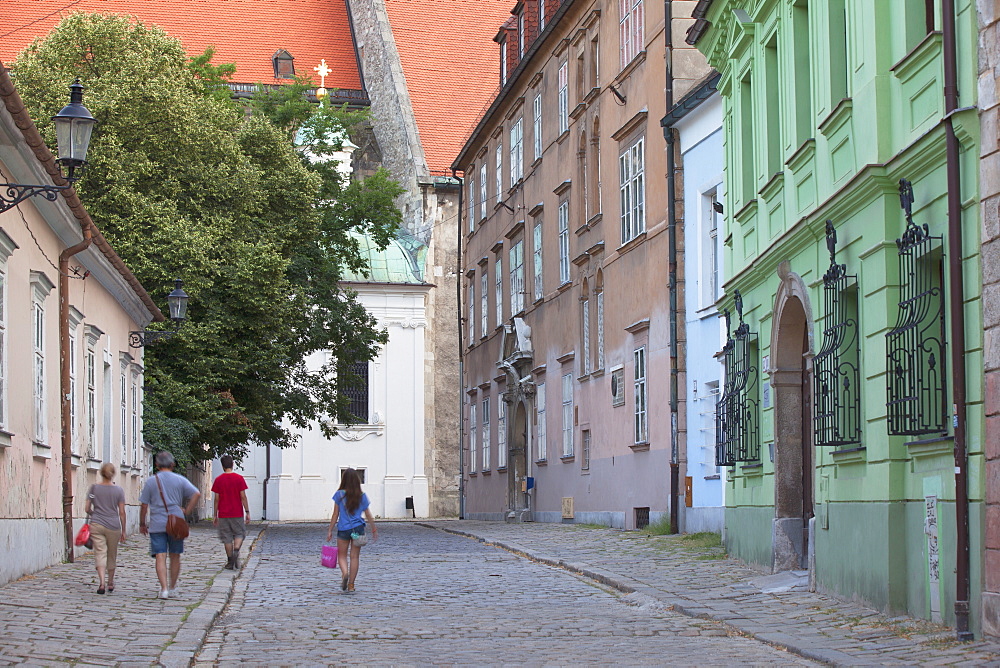 People walking along Kapitulska Street in Old Town, Bratislava, Slovakia, Europe 