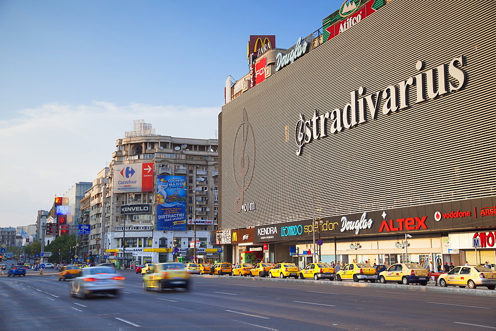 Traffic passing Unirea shopping mall, Bucharest, Romania, Europe