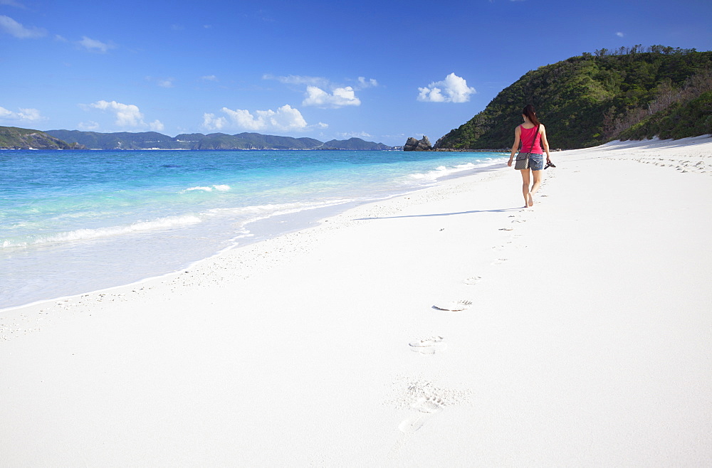 Woman walking on Nishibama Beach, Aka Island, Kerama Islands, Okinawa, Japan, Asia 