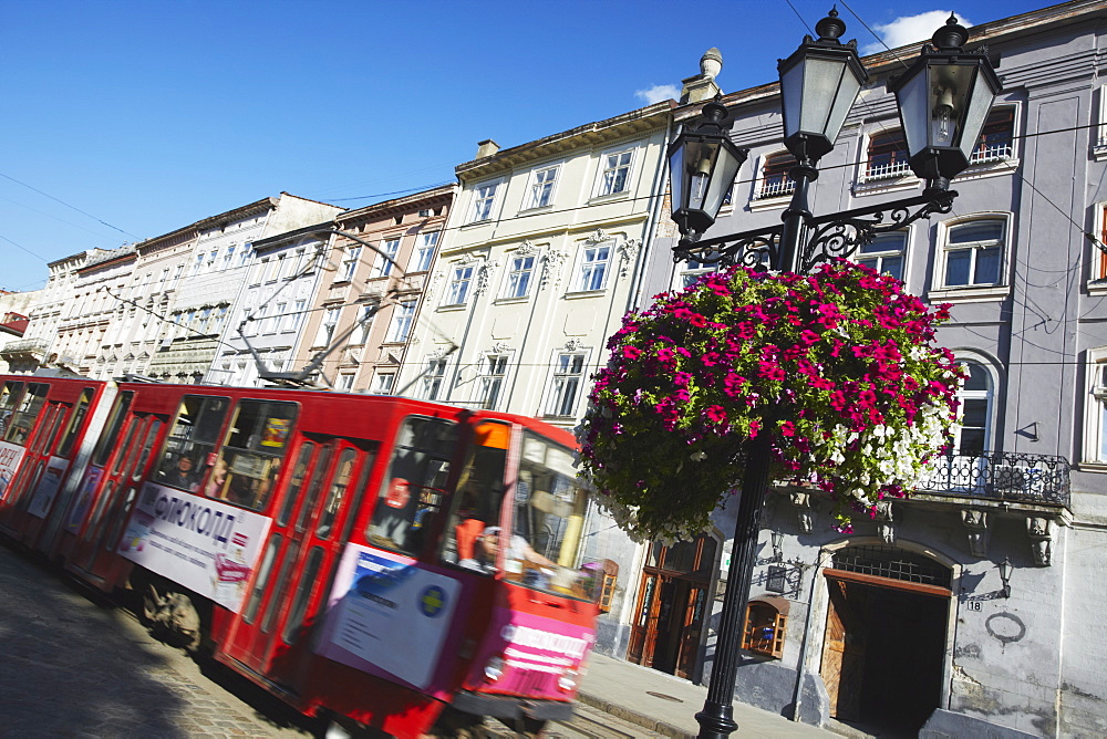 Tram passing through Market Square (Ploscha Rynok), Lviv (Lvov), Western Ukraine, Ukraine, Europe