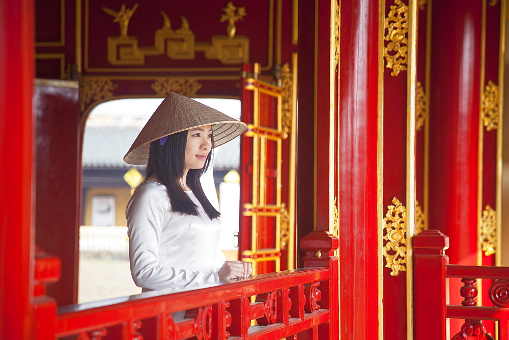 Woman wearing Ao Dai dress in Imperial Palace inside Citadel, Hue, Thua Thien-Hue, Vietnam, Indochina, Southeast Asia, Asia