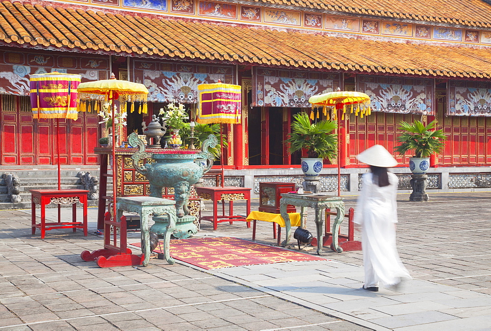 Woman wearing Ao Dai dress at Mieu Temple inside Citadel, Hue, Thua Thien-Hue, Vietnam, Indochina, Southeast Asia, Asia