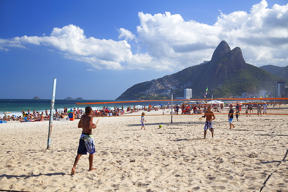 People playing tennis on Ipanema beach at dawn, Rio de Janeiro, Brazil, South America