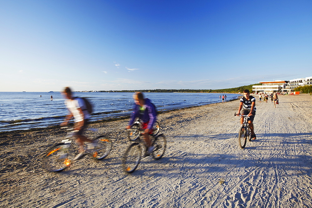 Cyclists on Pirita Beach, Tallinn, Estonia, Baltic States, Europe