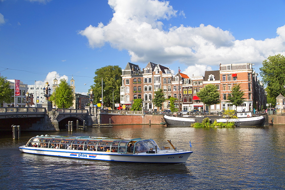 Tourist cruise boat on Amstel River, Amsterdam, Netherlands, Europe