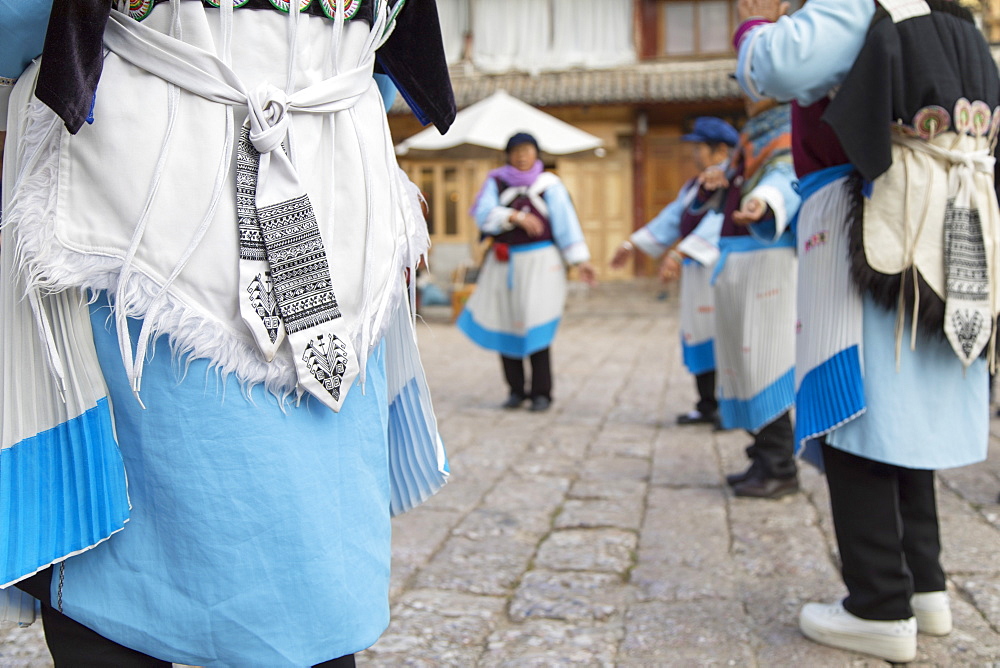 Naxi women performing dance, Lijiang, UNESCO World Heritage Site, Yunnan, China, Asia