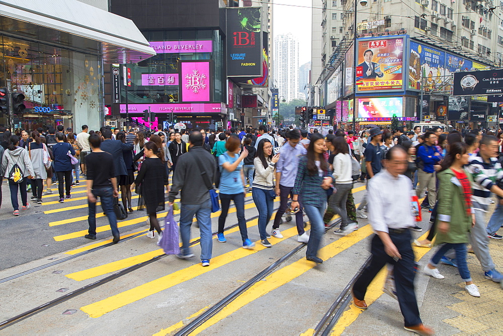 Pedestrians crossing street, Causeway Bay, Hong Kong Island, Hong Kong, China, Asia