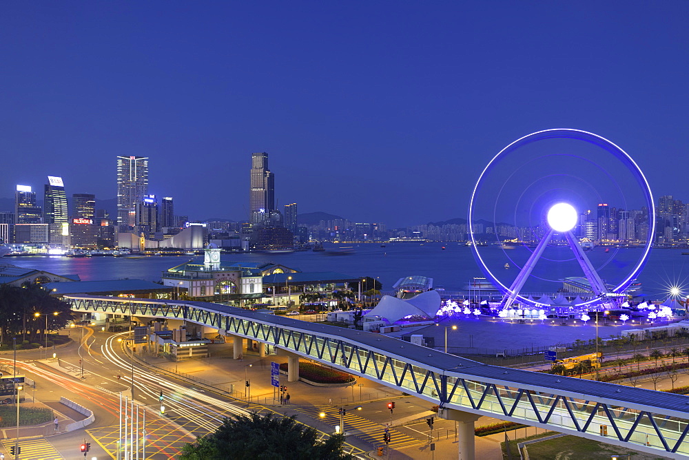 View of Star Ferry pier, observation wheel and Tsim Sha Tsui skyline, Central, Hong Kong, China, Asia