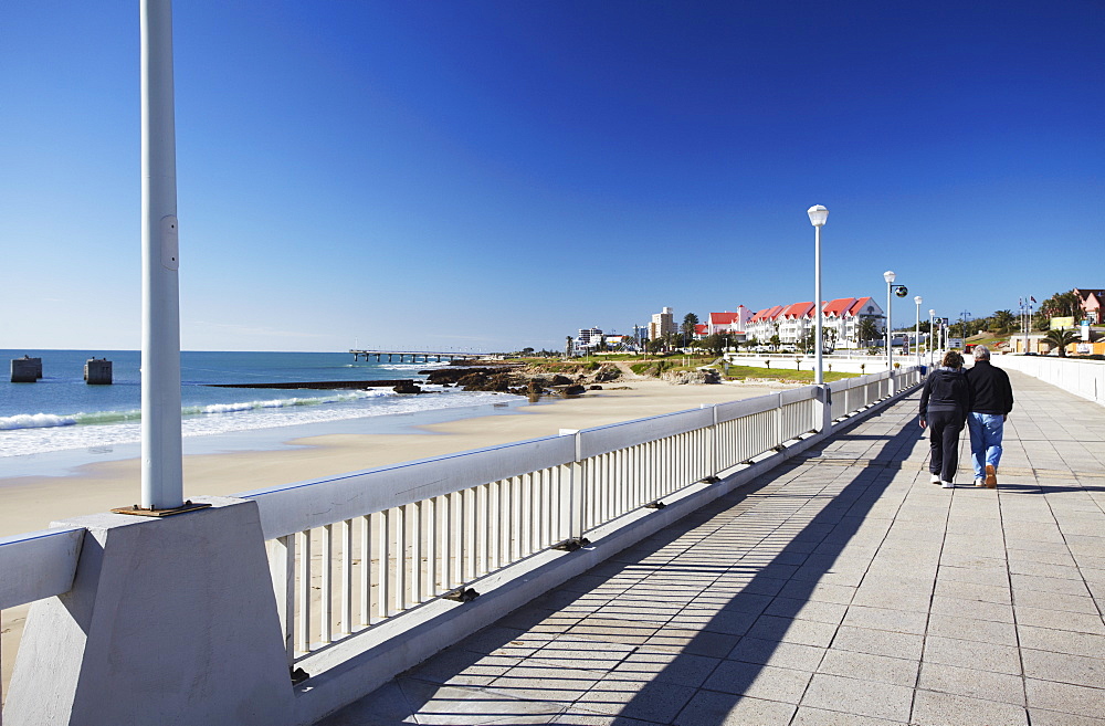 Couple walking along Humewood beachfront, Port Elizabeth, Eastern Cape, South Africa, Africa