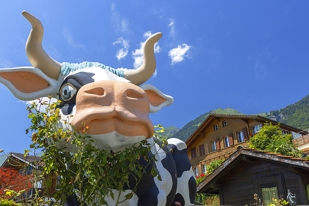 Cow statue and traditional chalets, Brienz, Switzerland