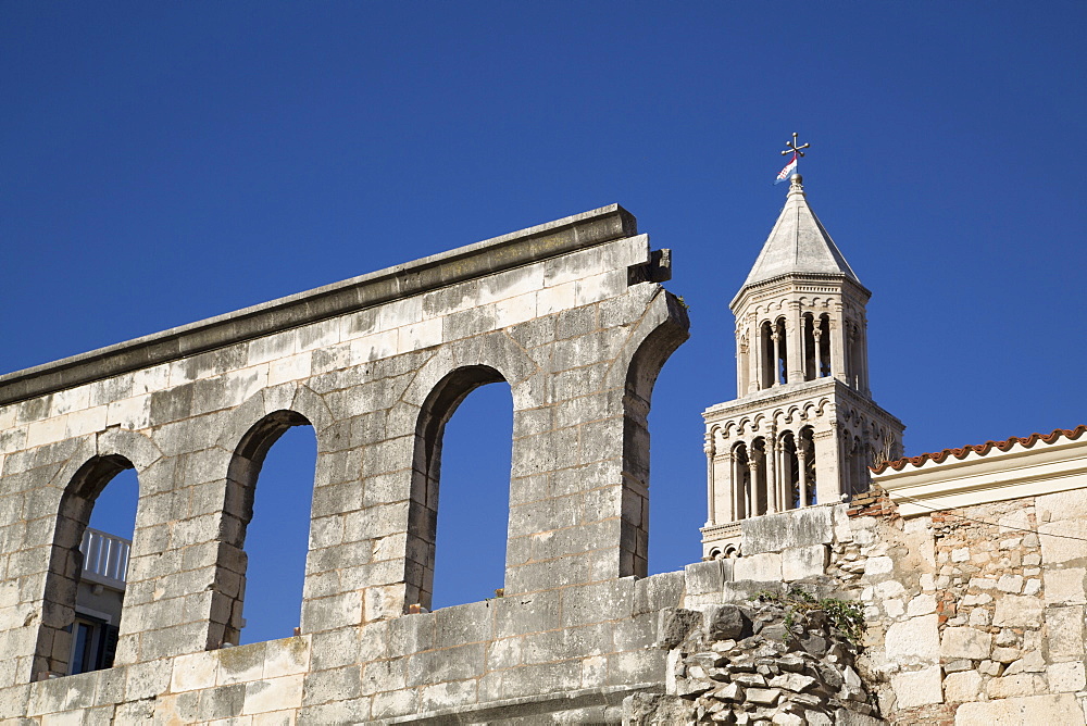 Outer wall of Diocletian's Palace near Silver Gate and tower of Cathedral of St. Domnius behind, UNESCO World Heritage Site, Split, Dalmatia, Croatia, Eruope