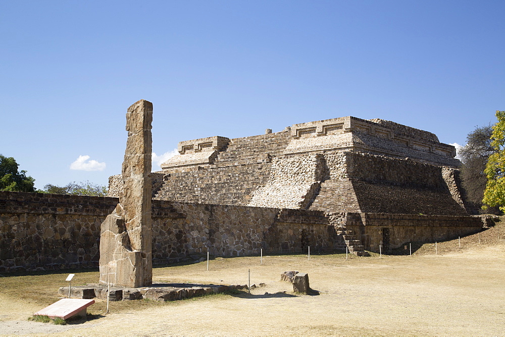 Stela 18 dating from 100 BC to 300 AD in foreground, with Building Group IV, Ceremonial Complex in the background, Monte Alban, UNESCO World Heritage Site, Oaxaca, Mexico, North America