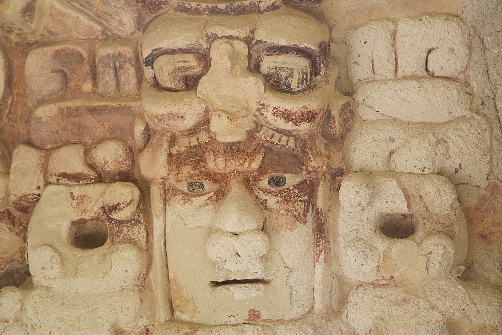 Stone mask of Mayan Sun God Kinichna, taken through protective glass, Becan, Mayan Ruins, Campeche, Mexico, North America