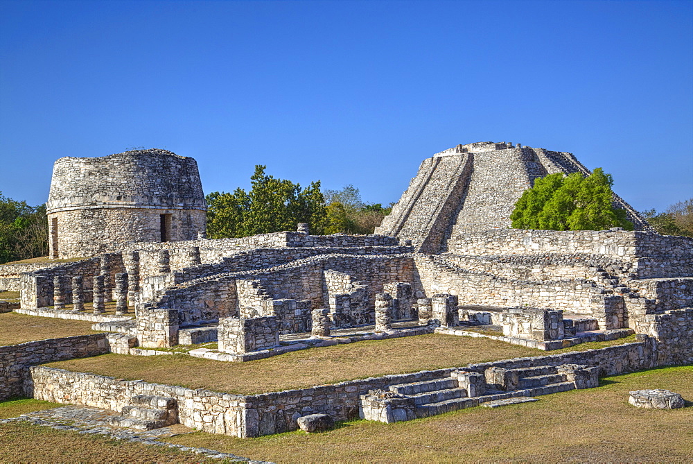 Overview, Round Temple to left at the back, and Castillo de Kukulcan to the right, Mayapan, Mayan archaeological site, Yucatan, Mexico, North America