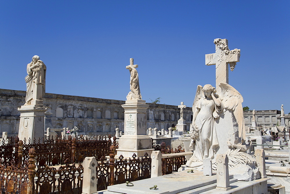 Statue of Archangel in foreground, La Reina Cemetery, Cienfuegos City, UNESCO World Heritage Site, Cienfuegos, Cuba, West Indies, Central America