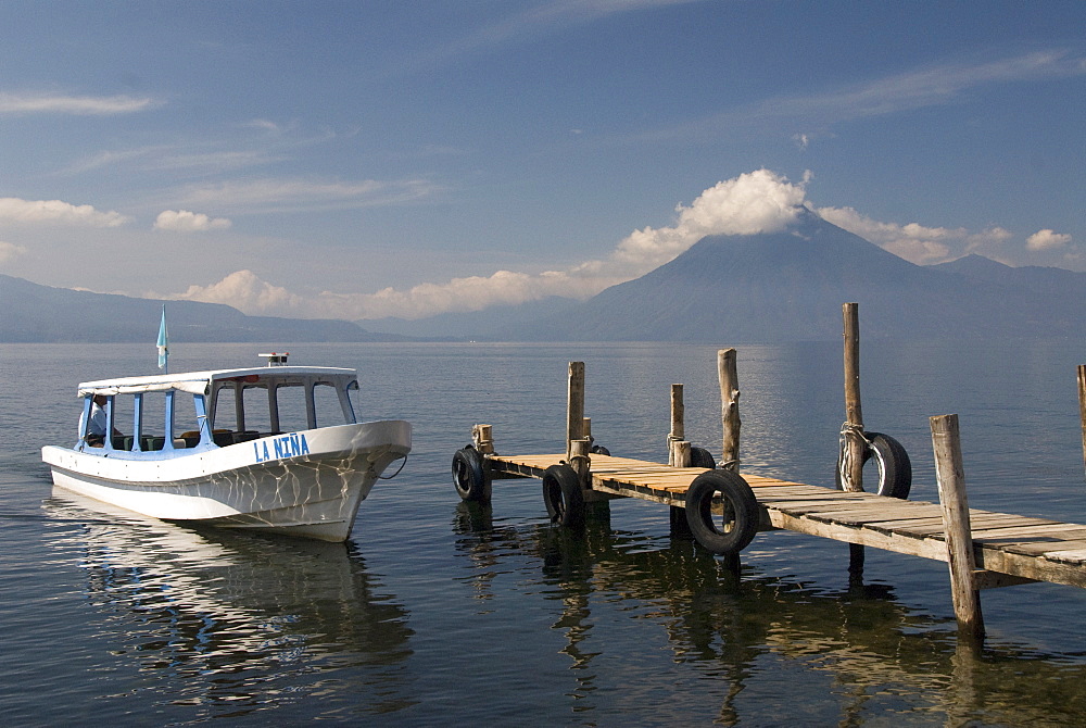 Tour boat near Panajachel, San Pedro Volcano in the background, Lake Atitlan, Guatemala, Central America