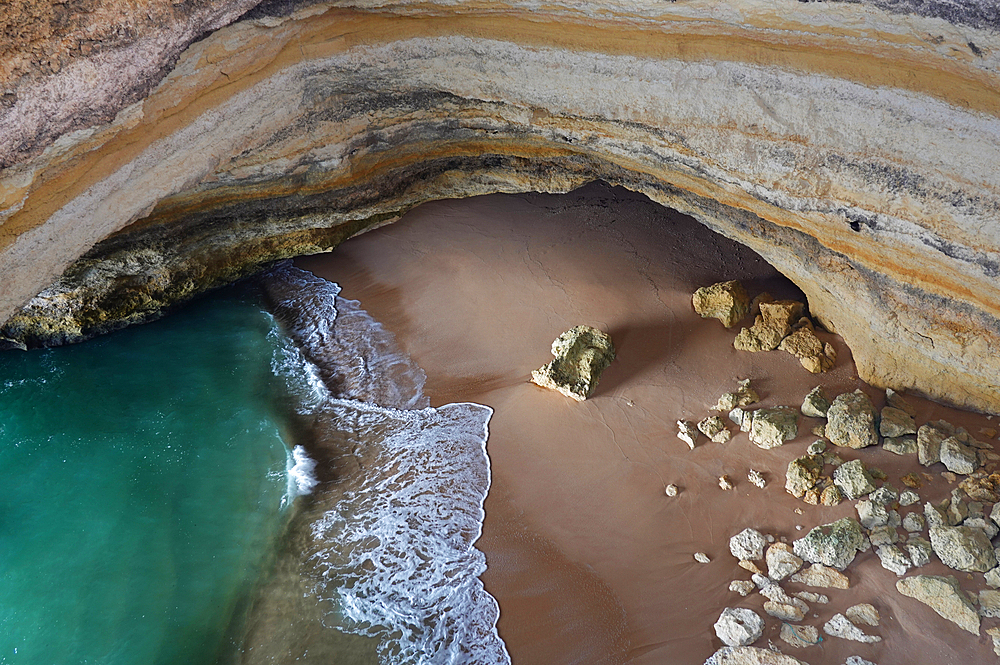 Gruta de Benagil sea cave, Algarve, Portugal. This gigantic cave is sometimes referred to as the Benagil Cathedral because of the various arches it forms. Viewed from the outside of the cave, this give it the appearance of a cathedral.