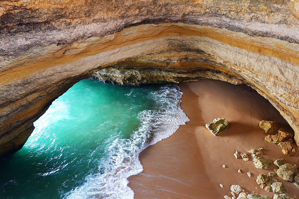 Gruta de Benagil sea cave, Algarve, Portugal. This gigantic cave is sometimes referred to as the Benagil Cathedral because of the various arches it forms. Viewed from the outside of the cave, this give it the appearance of a cathedral.