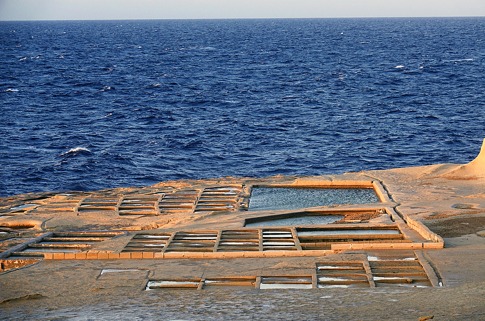 Salt-pans dating back to Roman times on the west coast of the island of Gozo, Malta