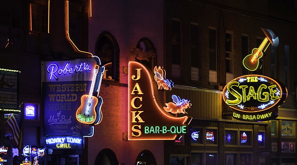 Neon signs and historic music clubs along Lower Broadway in Nashville, Tennessee, United States of America, North America