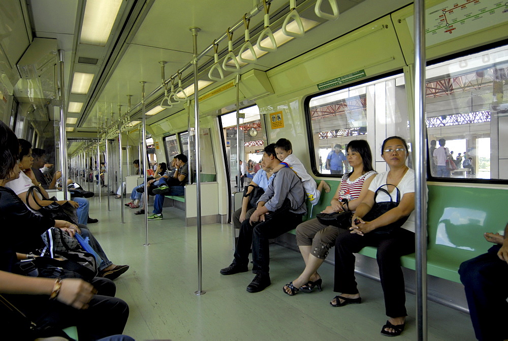 Passengers on a mass rapid transit train in Singapore, Southeast Asia, Asia