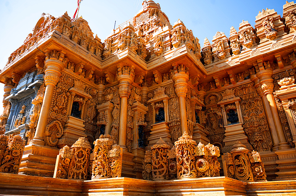 Well maintained golden Taranga Vihar Dham Tirth, a sacred Hindu pilgrimage site, alongside the road between Dhrangadhra and Halyad