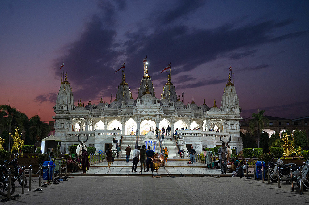 Hindu devotees at sunset attending the Shree Swaminarayan Mandir (temple), built following the 2001 earthquake