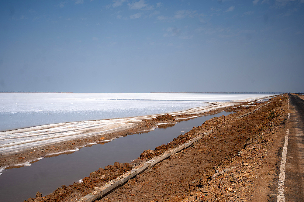 Vast white salt lake viewed from constructed raised road leading from Khavda to Dholavira close to the border with Pakistan