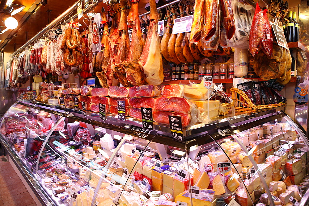 Hams hanging in market, Barcelona, Catalonia, Spain, Europe